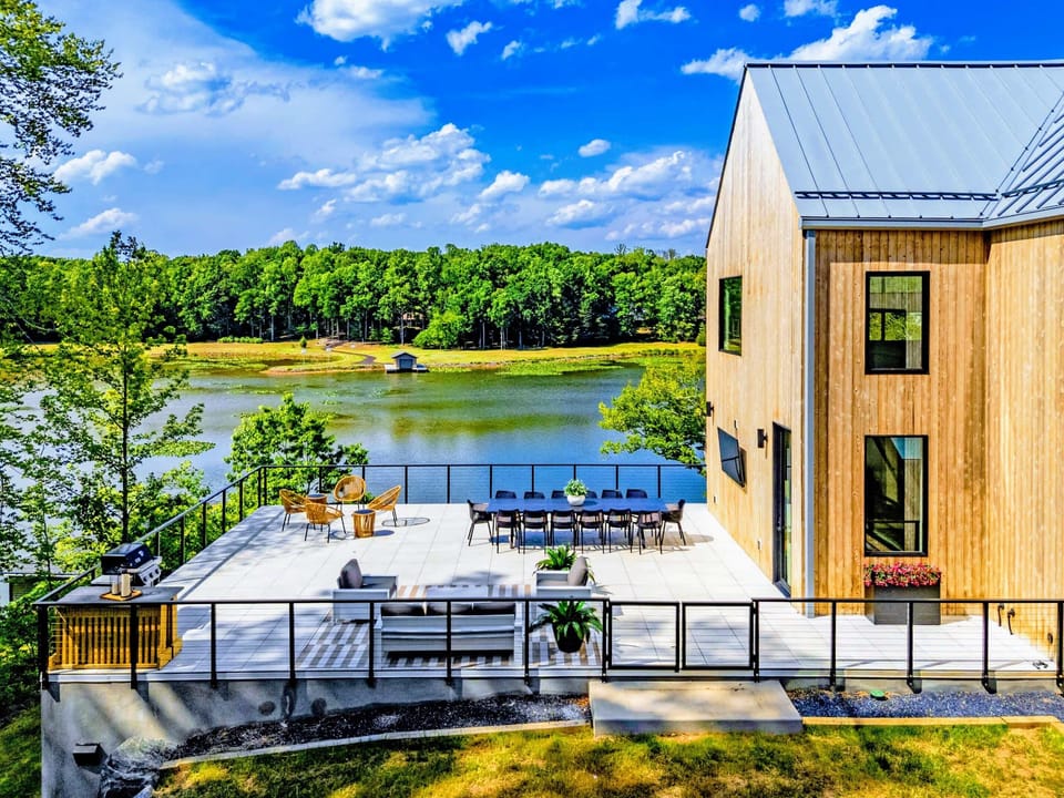 Exterior - House and private dock with the calm cove beyond.