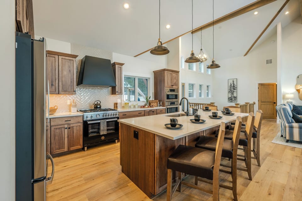 A generous island with seating—perfect for coffee chats, snacks, and keeping the cook company.