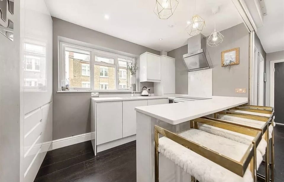 Modern kitchen with a breakfast bar and plenty of natural light