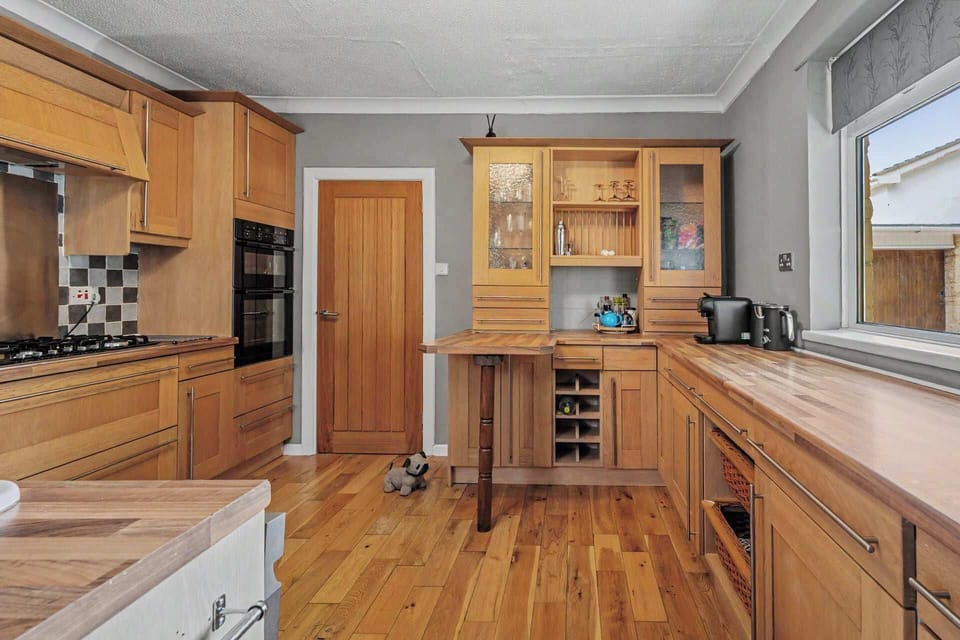 A bright and practical kitchen with all the essentials for a comfortable stay, perfect for families who enjoy having the option to dine in.