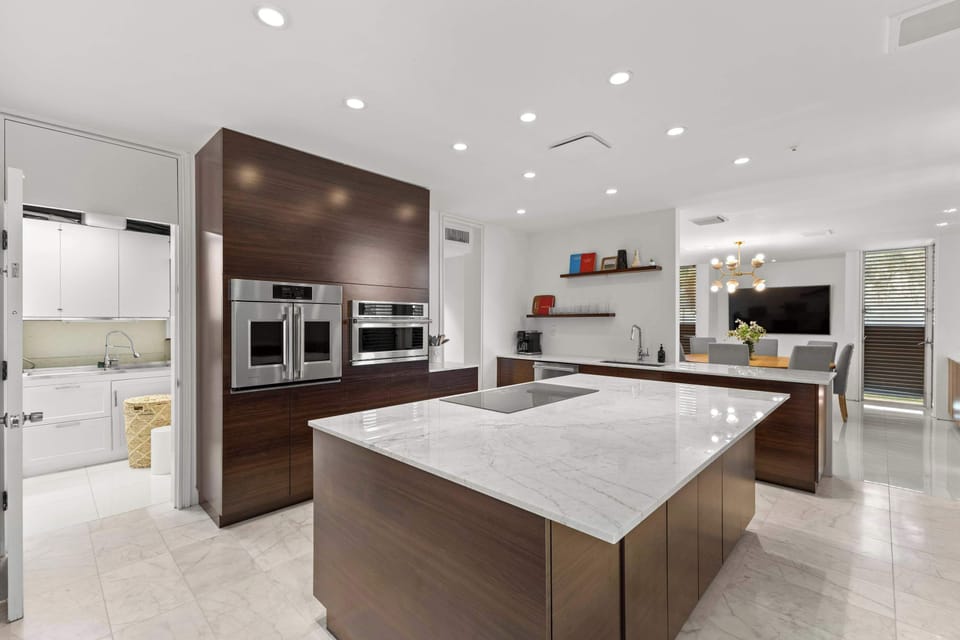Featuring designer finishes, ample storage, and a spacious layout, this contemporary kitchen is as beautiful as it is functional.