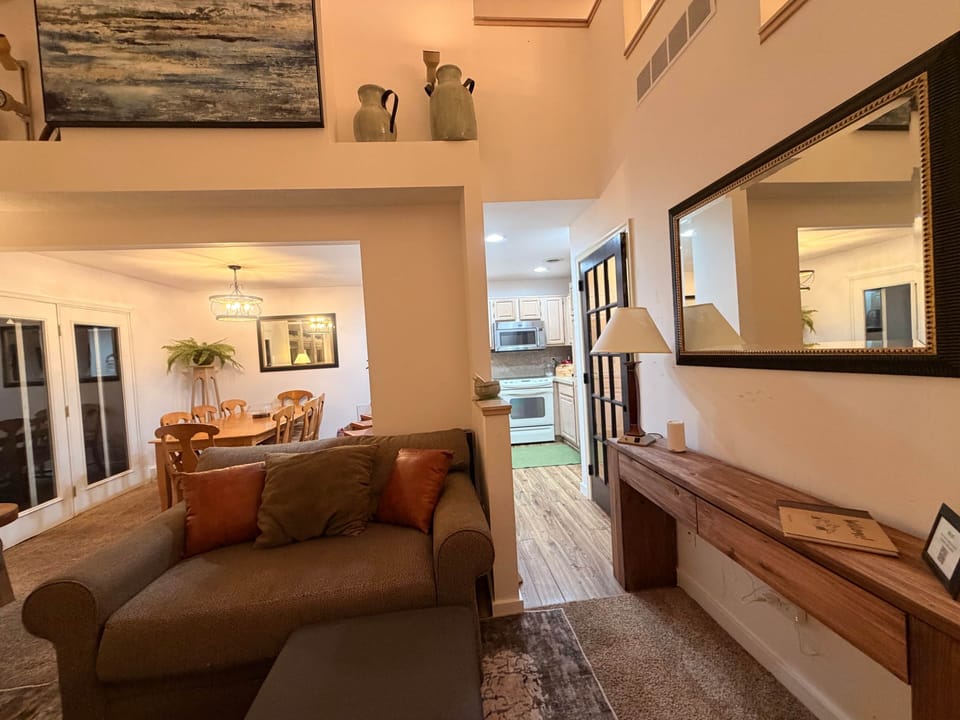 Open concept living area, door to basement