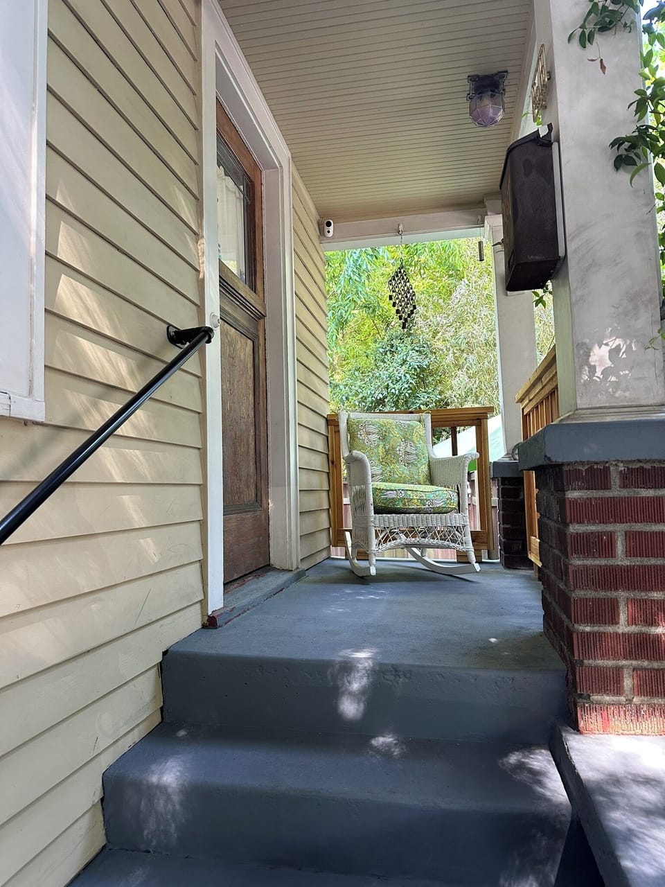 Front Porch Oasis: Enjoy the quiet bustle of the neighborhood with your coffee
