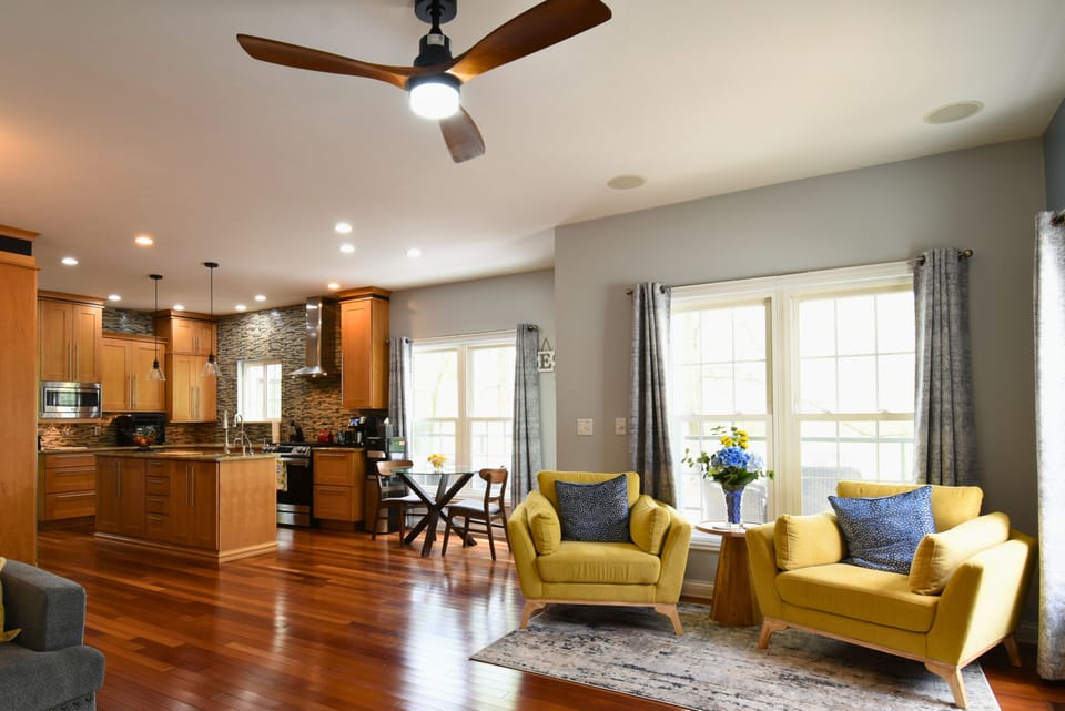 “Bright open-concept layout seamlessly connects the living space to a fully equipped kitchen—ideal for gathering and entertaining.”