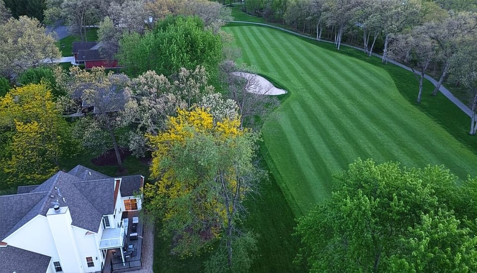 “Step into serenity with direct views of lush fairways and scenic greens just steps from your backyard.”