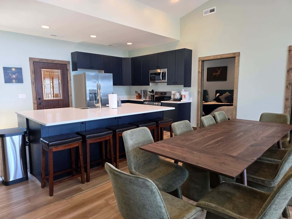 The upstairs kitchen is an open concept with the dining area and upstairs living room.