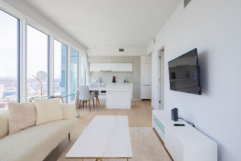 Take in the airy ambiance from every angle, with sleek furnishings and a panoramic skyline backdrop
