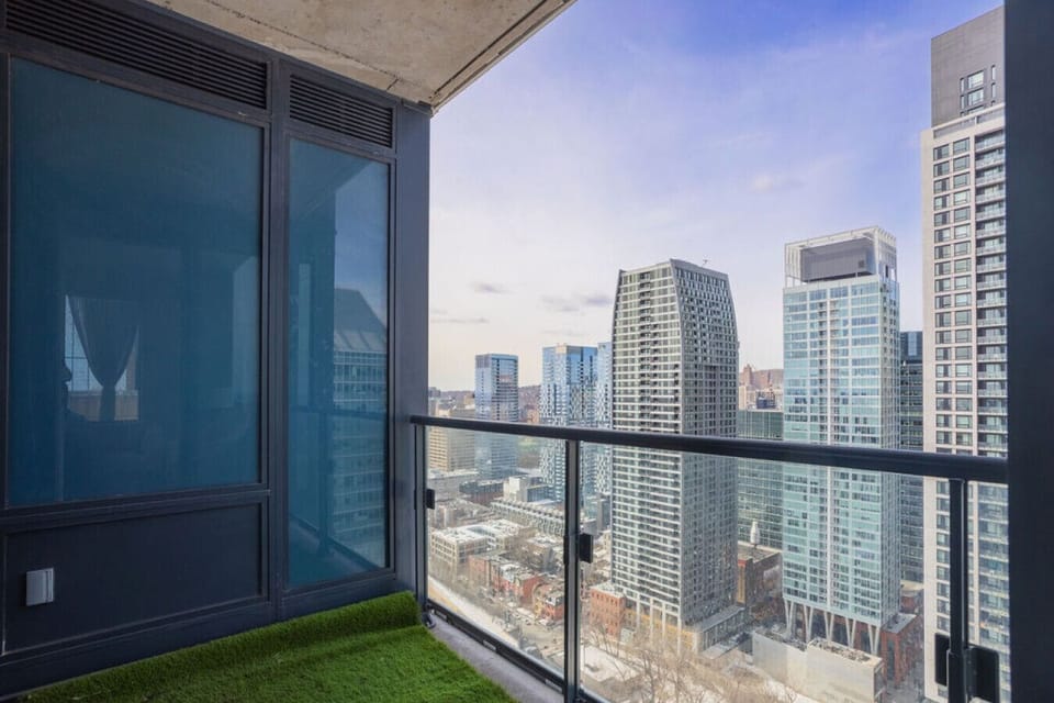 Take in the breathtaking city skyline from your private balcony retreat