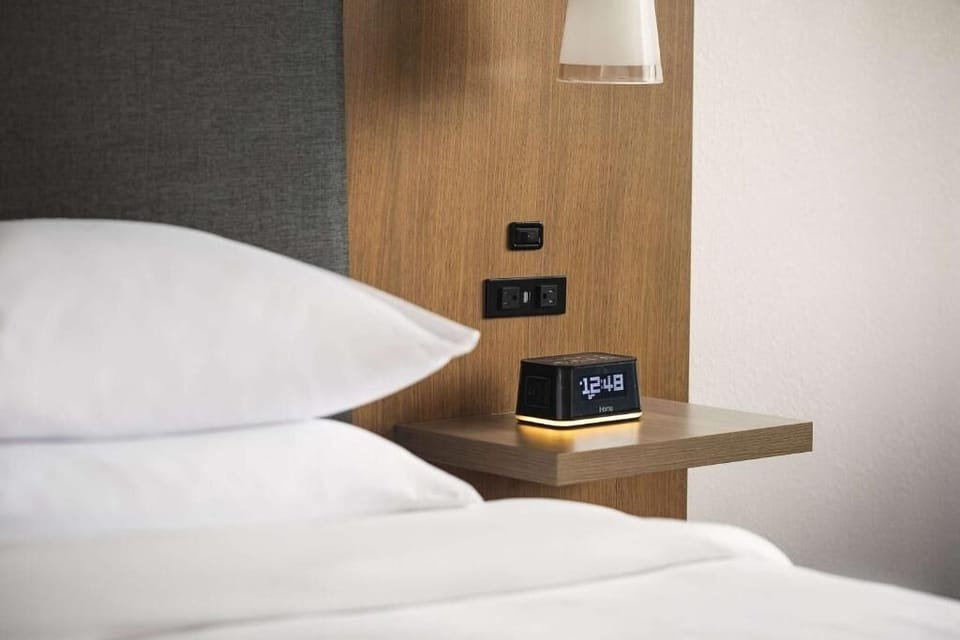 Drift off easily with bedside lighting and a quiet clock.