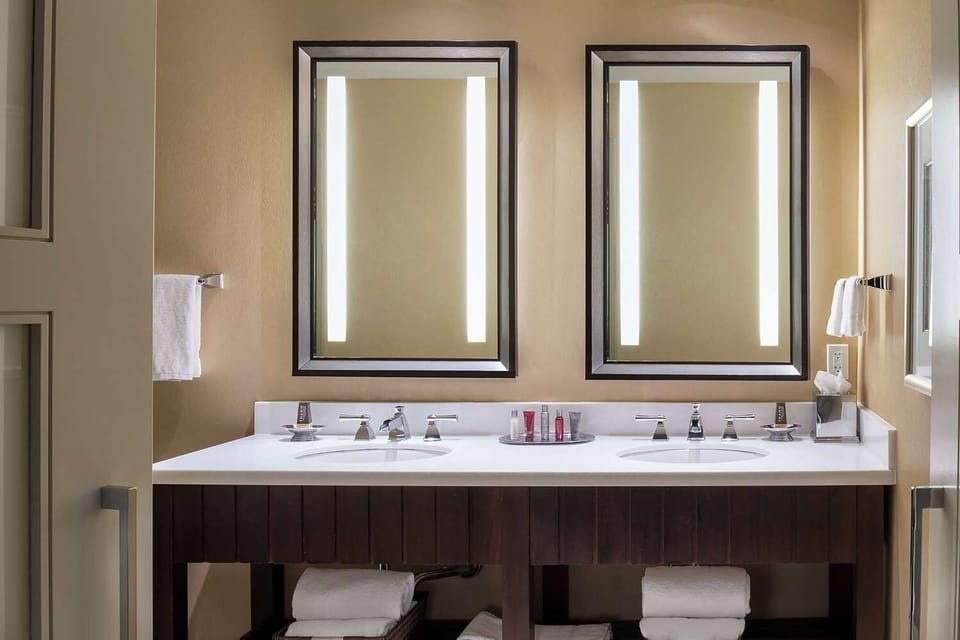 Refresh your morning routine with double sinks and bright mirrors.