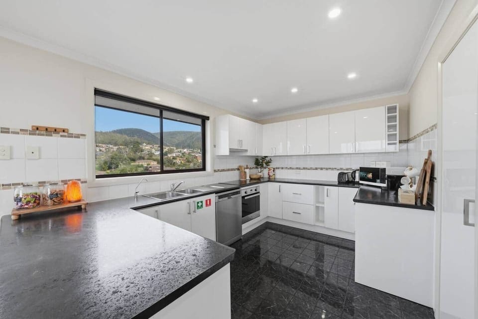 Fully equipped kitchen with everything needed for home-cooked meals during your Tasmanian stay.