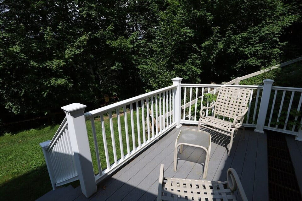 Back Patio Next to Snow Brook and Easy walking path to Town Square from Condo In Waterville Valley