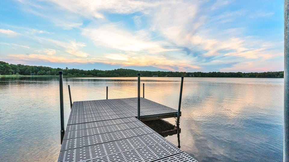 Private dock with serene lake views—perfect for relaxing or launching water adventures.