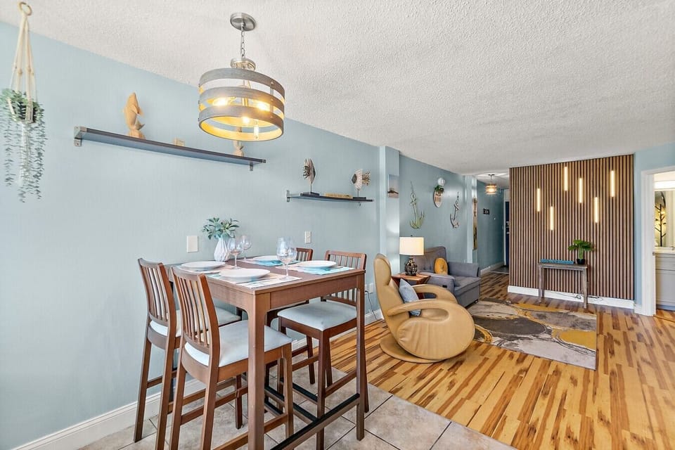 Dining area and living space with casual coastal decor.