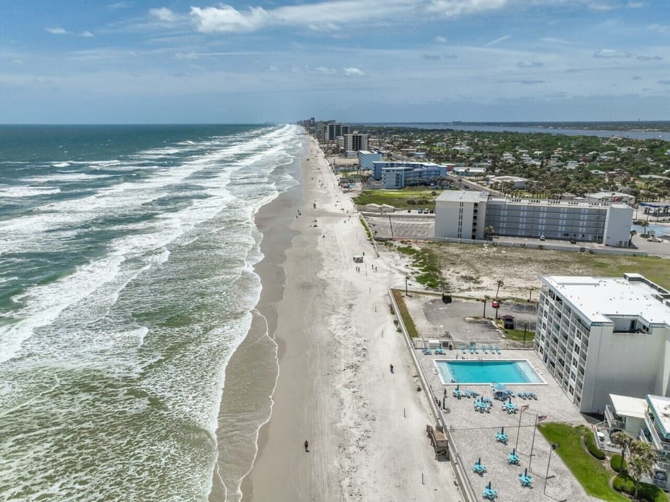 Beachfront location with pool access and ocean views.