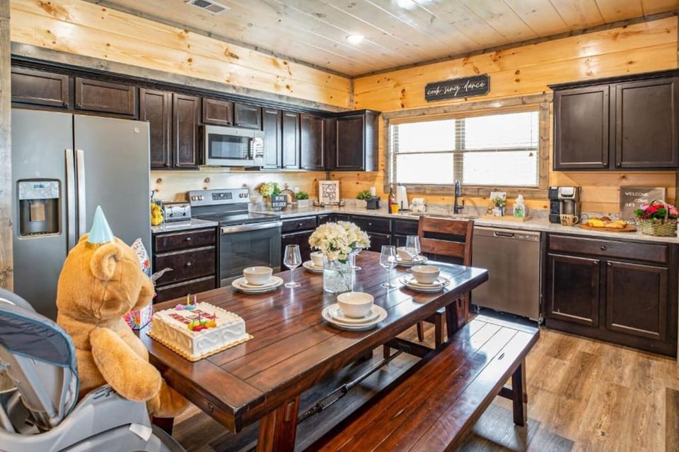 Kitchen & Dining Area: Gather around the rustic table for unforgettable meals and joyful laughter!