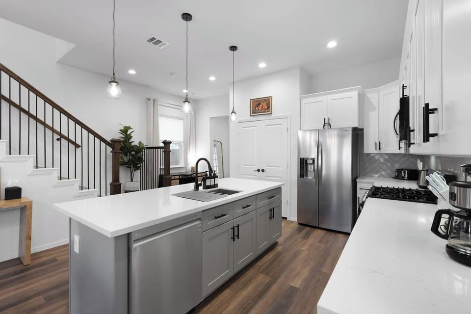 Kitchen: Sleek quartz counters and modern appliances await your culinary adventures in Texas!