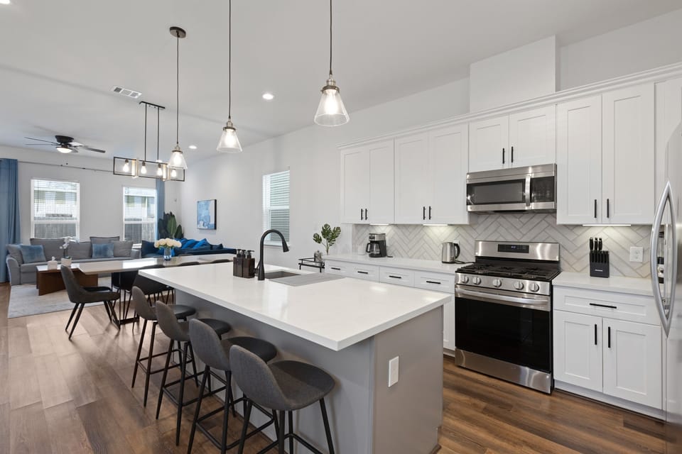 Modern Kitchen & Living Space: Enjoy cooking and lounging in style with sleek finishes and ample seating!
