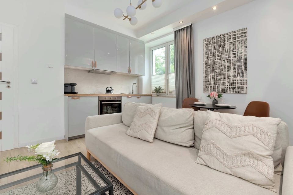 Elegant living room featuring comfortable seating, stylish décor, and plenty of natural light.