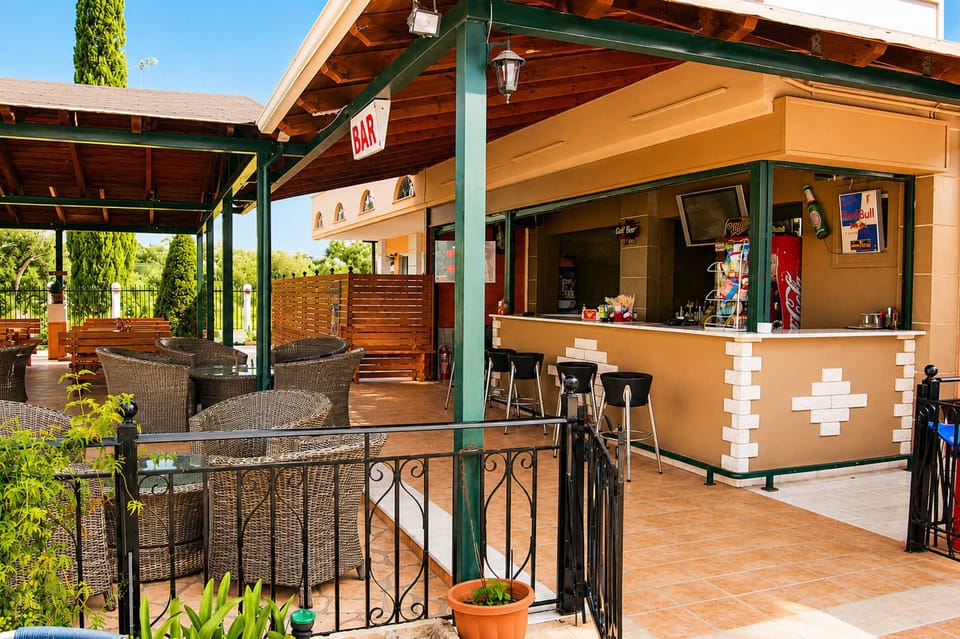 A relaxed outdoor setting where you can enjoy a drink, unwind in the shade, and spend time with family or friends after a day exploring the island.