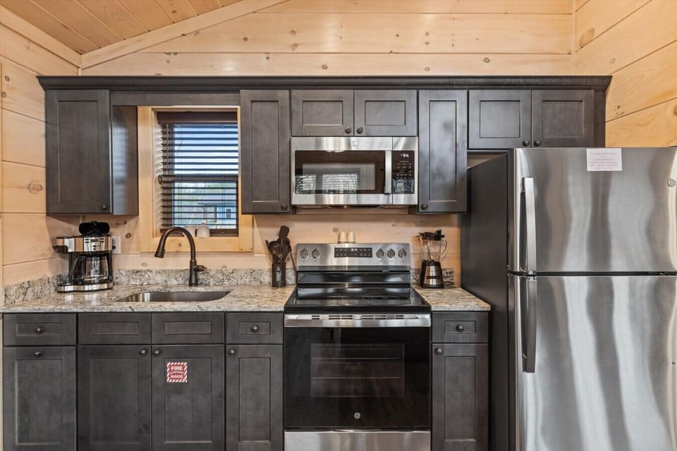 Full kitchen with drip coffee pot, microwave and stove