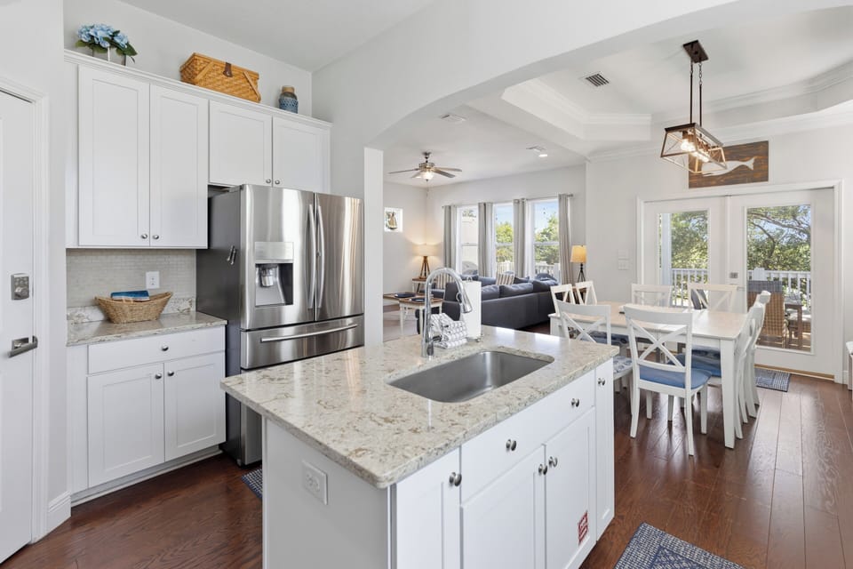 Relax in your open-concept haven where the fully equipped kitchen, cozy living area, and sunny dining nook flow seamlessly together—perfect for gathering with loved ones.