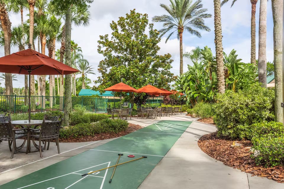 Unwind under swaying palms with outdoor games and loungers.