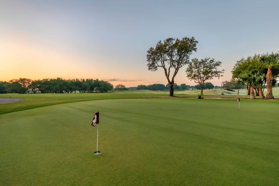 Tee off at sunrise on beautifully manicured championship greens.
