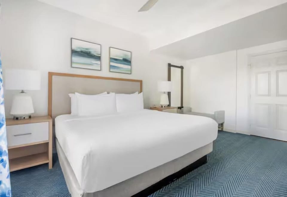 Unwind in crisp linens and a calm, airy retreat.