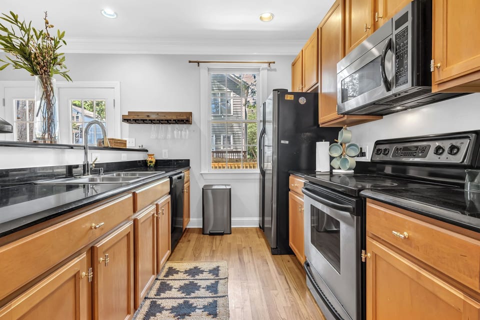 Bright galley kitchen with full-size appliances and ample counter space