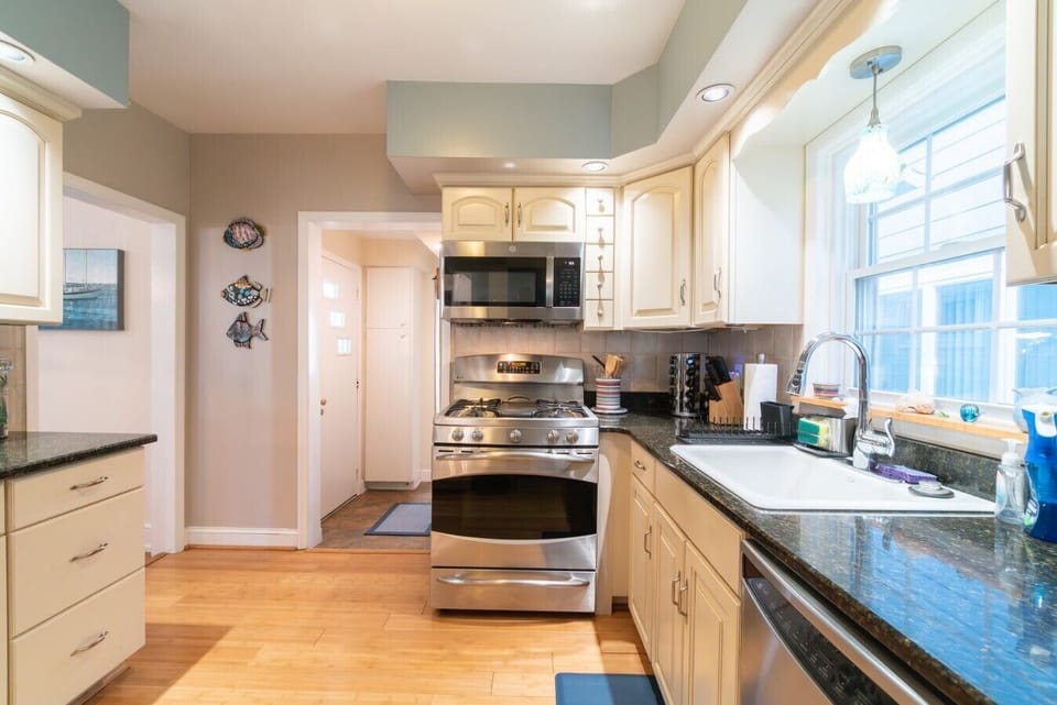 Fully equipped kitchen with everything you need to cook and dine in, featuring modern appliances.