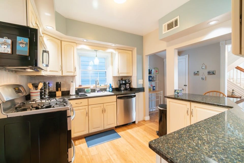 Fully equipped kitchen with everything you need to cook and dine in, featuring modern appliances.