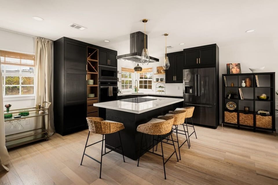 Modern kitchen with a spacious island, premium appliances, and seating for casual meals and conversation.