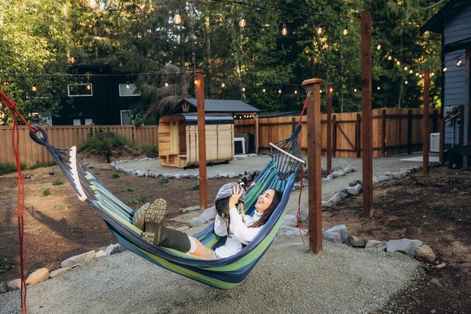 Backyard Hammock: Relax under the string lights and enjoy the peaceful forest surroundings.