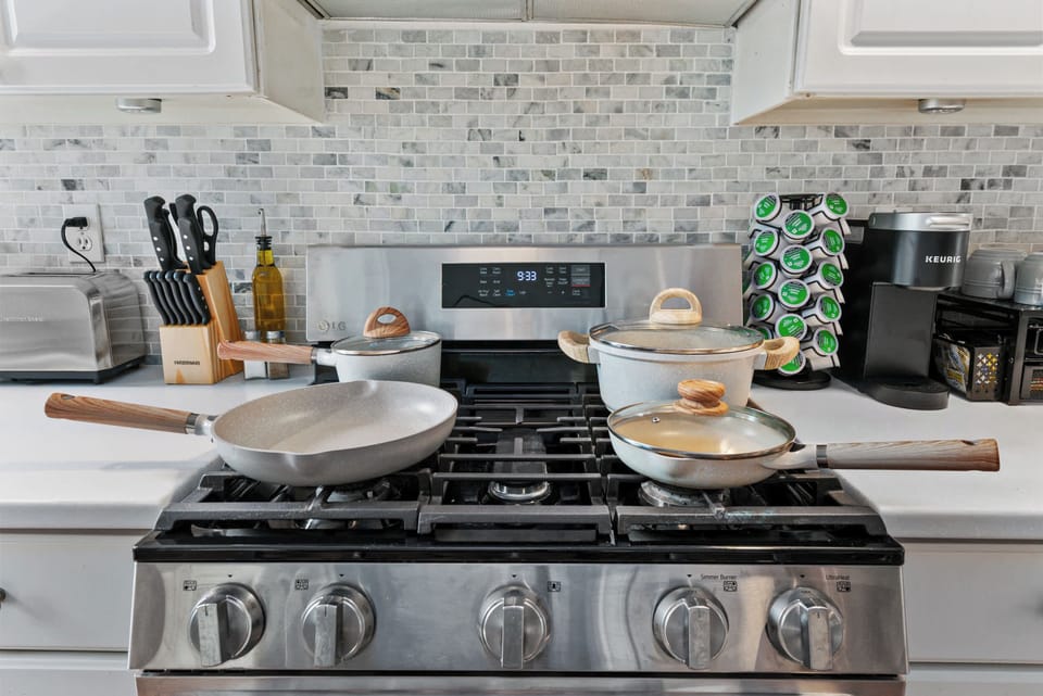 Cook and dine with ease in the fully equipped kitchen, featuring modern appliances, cookware, and everything needed to prepare meals, snacks, or your morning coffee during your stay.