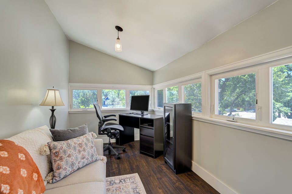 Dedicated workspace with fast Wi-Fi for remote work in a beautiful sunroom.