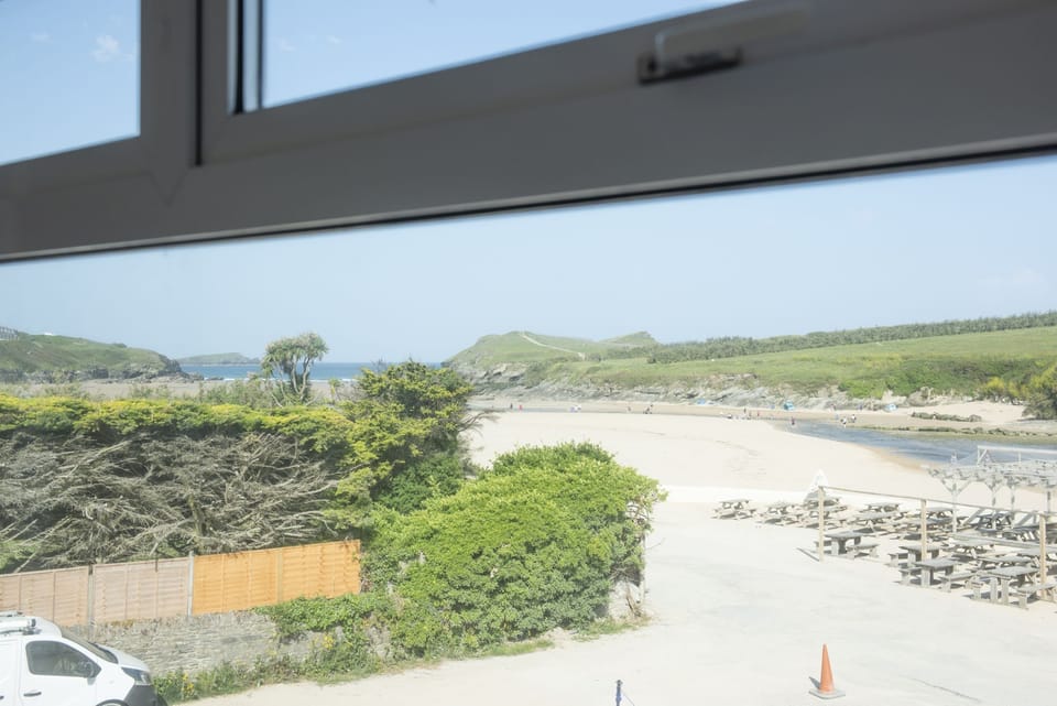 View of beach ad ocean from bedroom - Porth Beach House