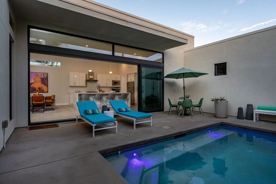 Pool Area: (2) sun chaise loungers, 4-person dining table with umbrella, outdoor shower, natural gas stainless steel grill