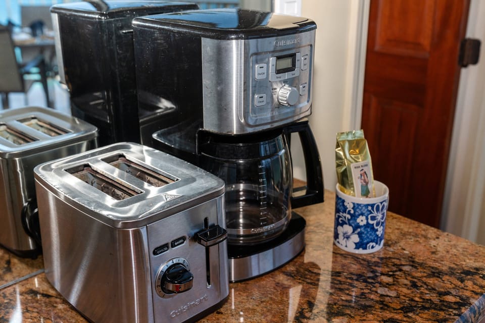 Countertop appliances including coffee maker and toaster for easy breakfast and snack preparation.