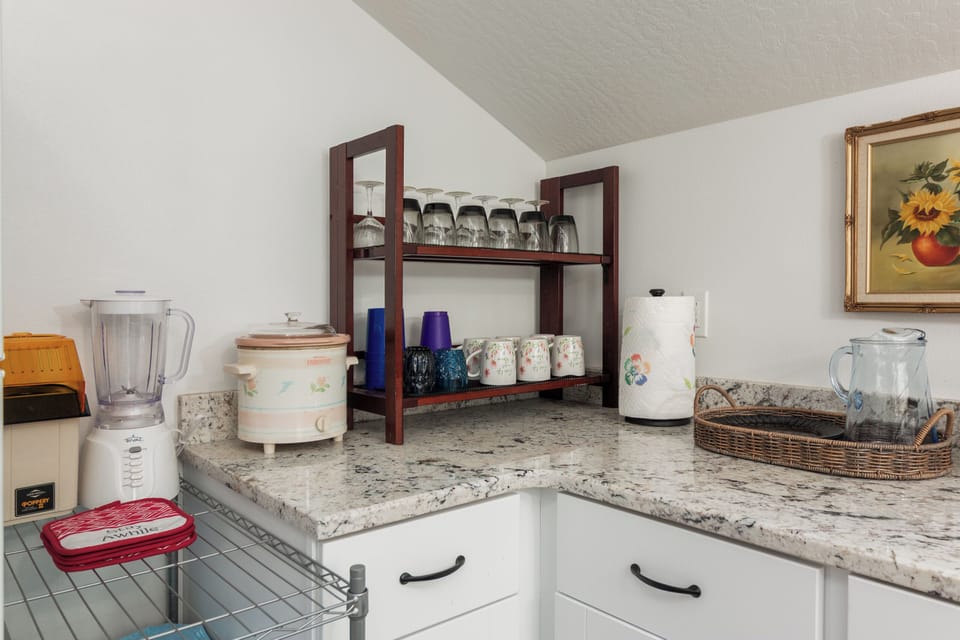 Your kitchenette is stocked with essentials—a blender, toaster, and slow cooker ready for preparing simple meals or refreshing drinks during your stay.