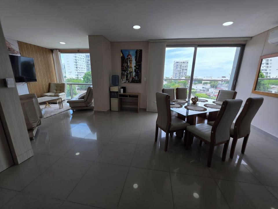 Sunny open-plan lounge & dining with city views and floor-to-ceiling windows