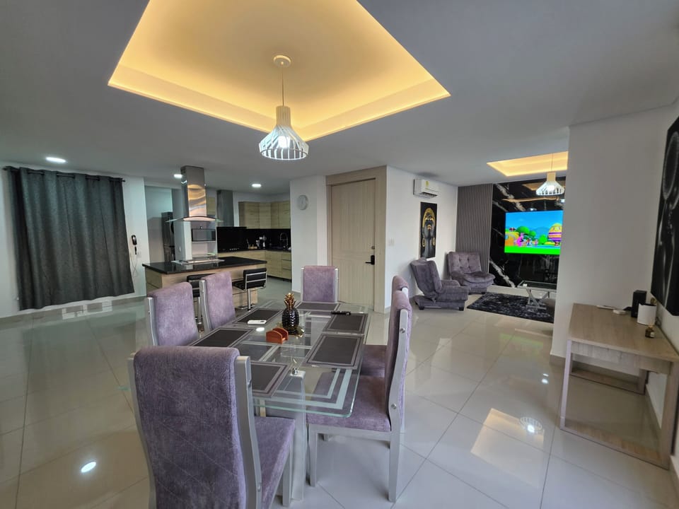 Stylish open-plan condo with sleek kitchen, plush lounge and LED-lit ceilings