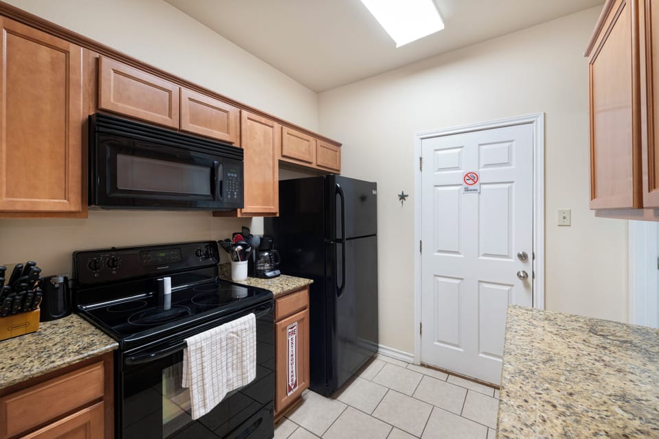 Your fully equipped kitchen features modern appliances, granite countertops, and plenty of cabinet space—everything you need to prepare delicious meals during your stay.