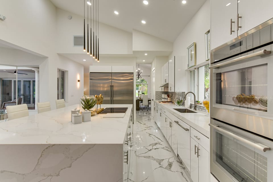 Sleek chef’s kitchen with waterfall island and premium appliances