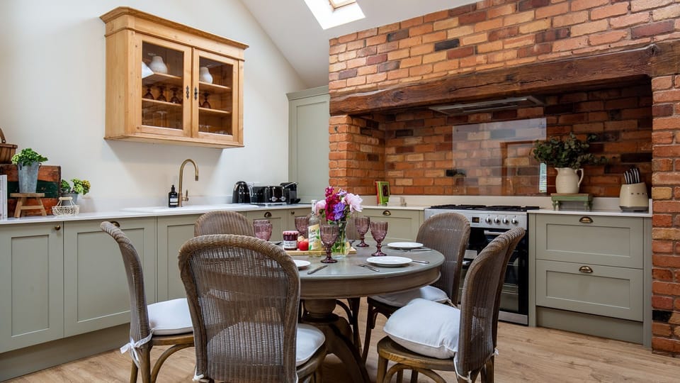 The spacious kitchen is fully-equipped with oven and hob, fridge-freezer,  microwave, toaster, kettle and Nespresso coffee machine