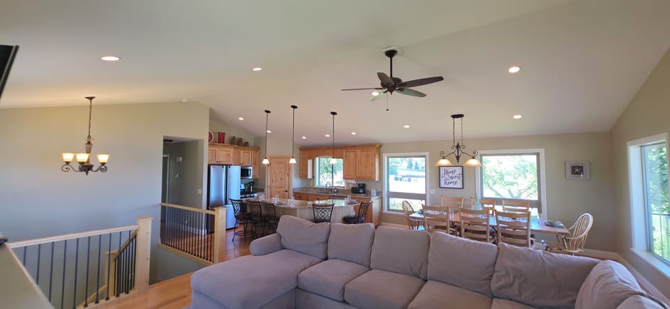 Bright open-concept living, dining, and kitchen space with room for groups