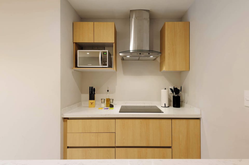 Functional kitchenette designed for convenient everyday cooking.