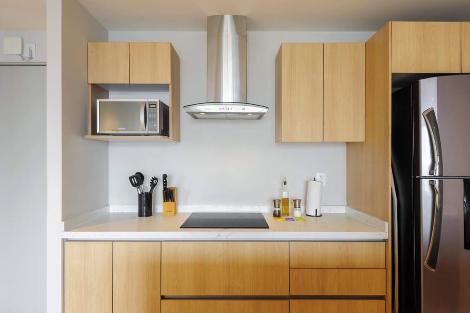 Fully equipped kitchen with modern appliances and ample storage.