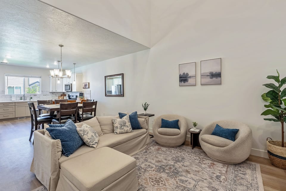 Bright open living space with vaulted ceilings and stylish cozy seating