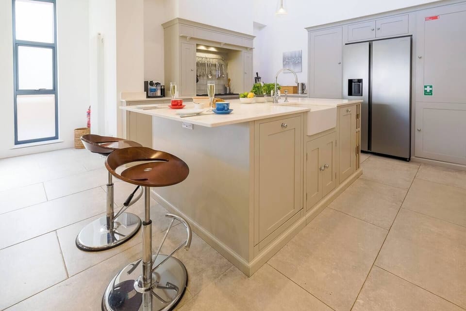 After the children leave for their adventures with their grandparents, the kitchen island provides a relaxing place for breakfast for two. 